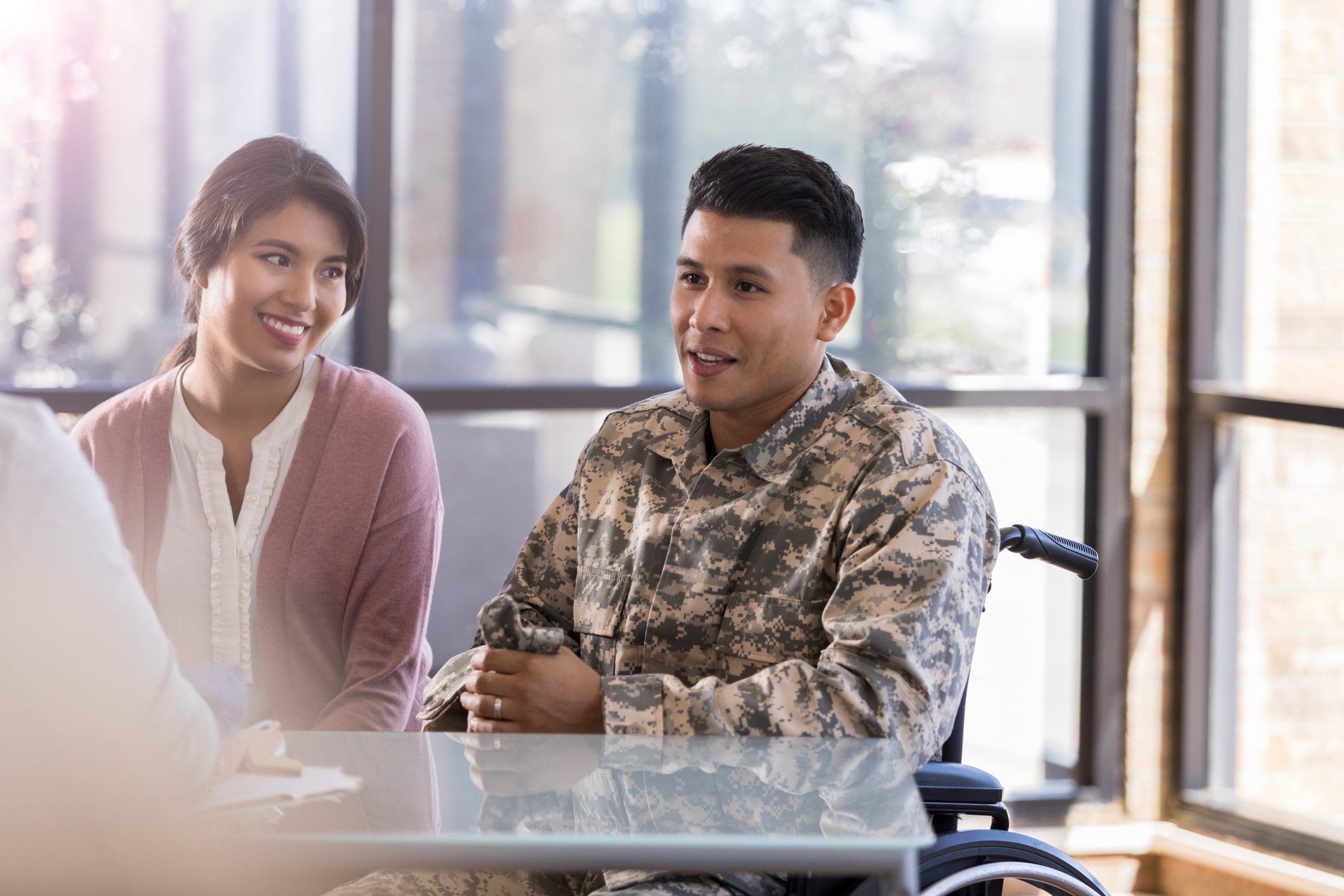 Soldier in wheelchair with supportive companion