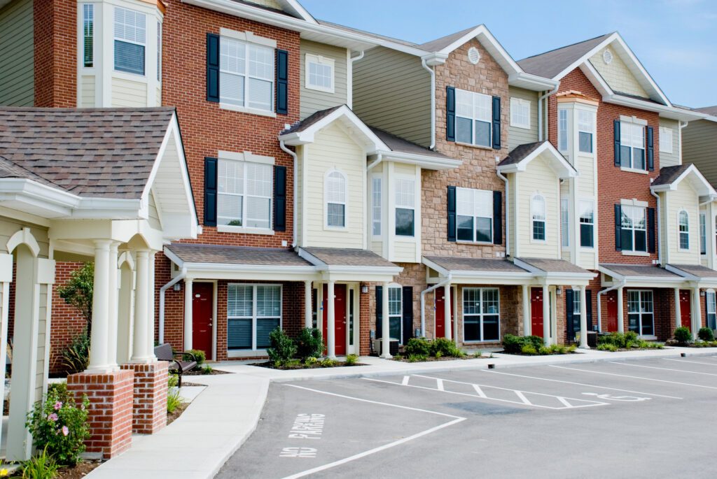 Modern brick townhouses with parking lot