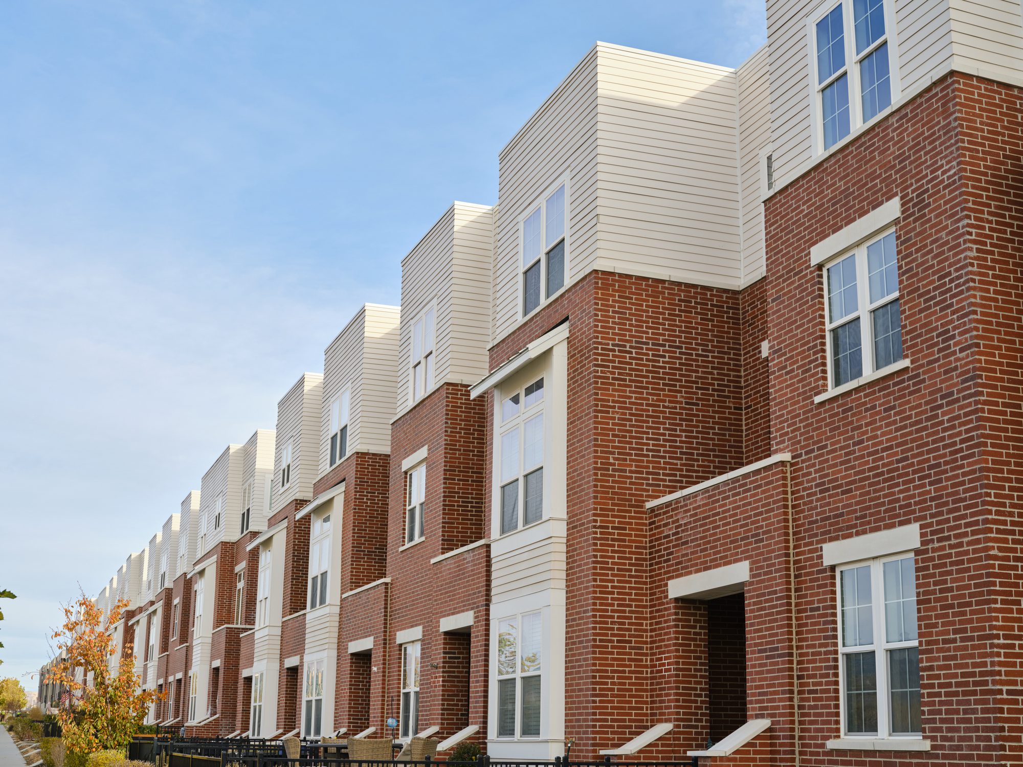 Row of modern red-brick townhouses