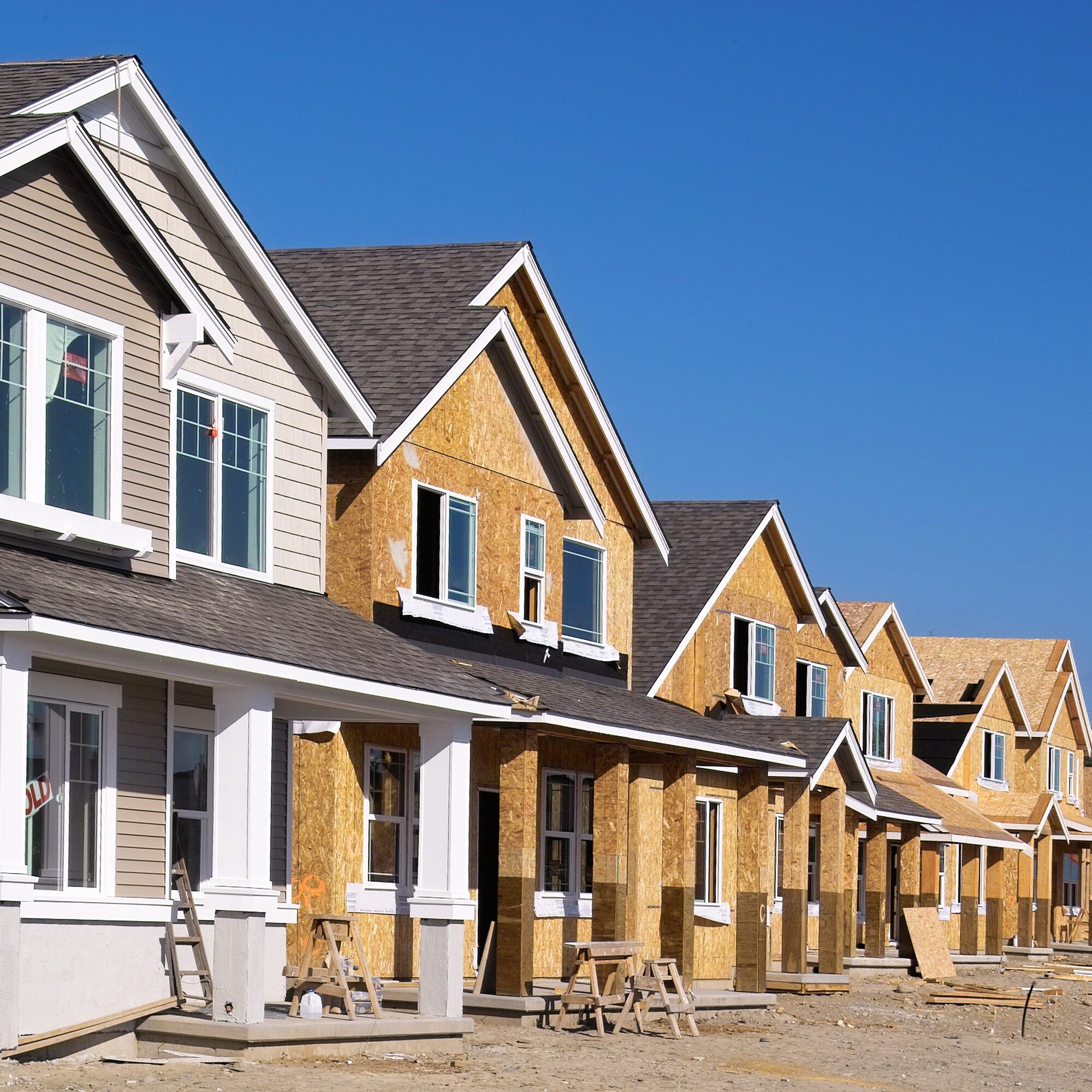 Row of new suburban houses under construction